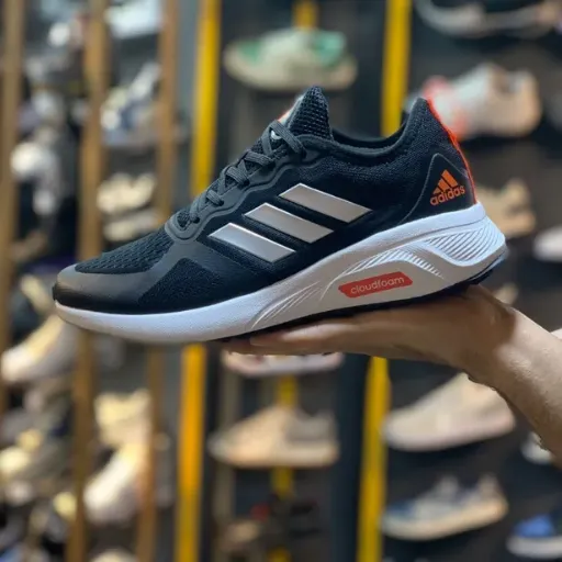 کفش ورزشی و رانینگ زنانه آدیداس مدل Adidas Cloudfoam - مشکی با جزئیات نارنجی و زیره سفید | مستر کوالیتی